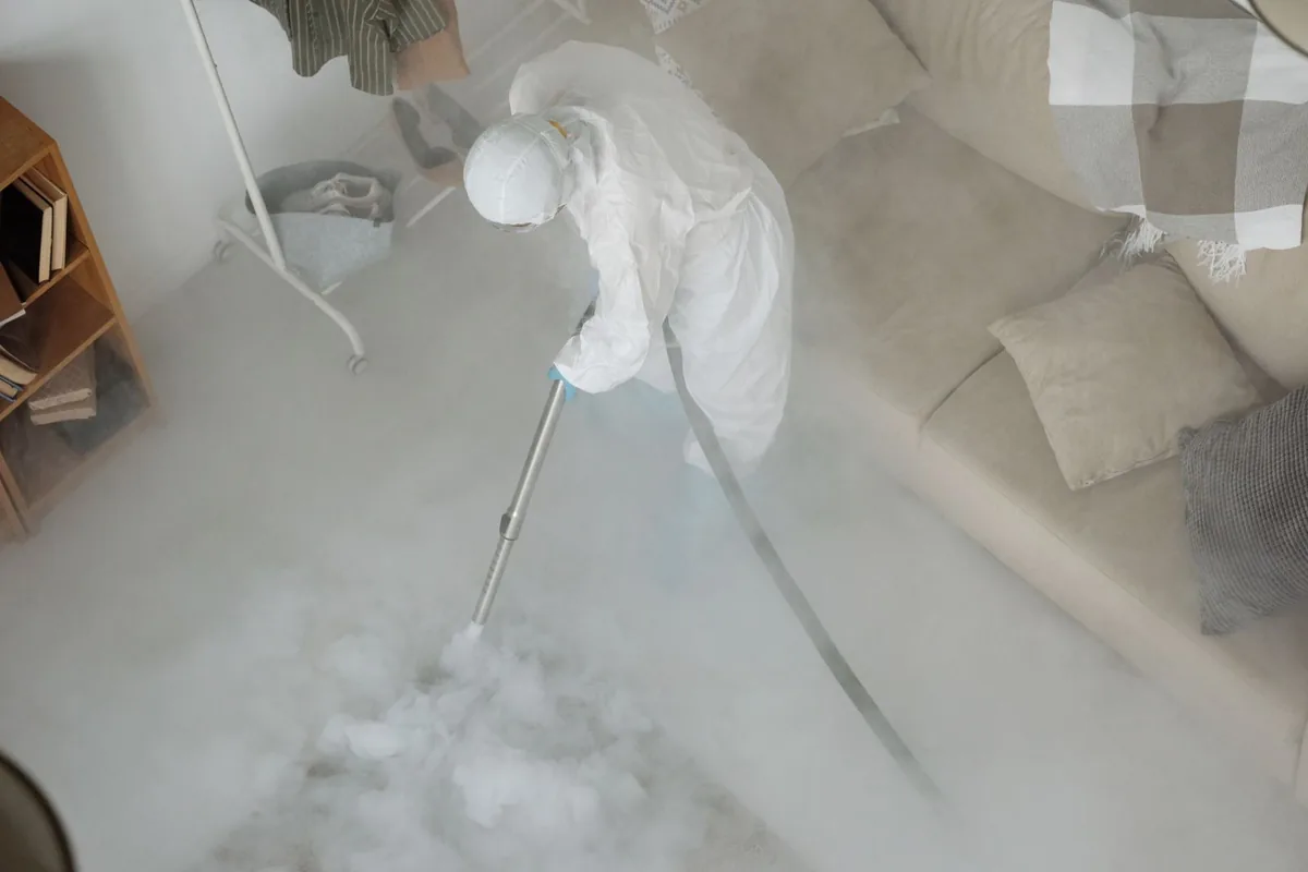 Biohazard cleanup technician in protective equipment, Holly Springs, MS